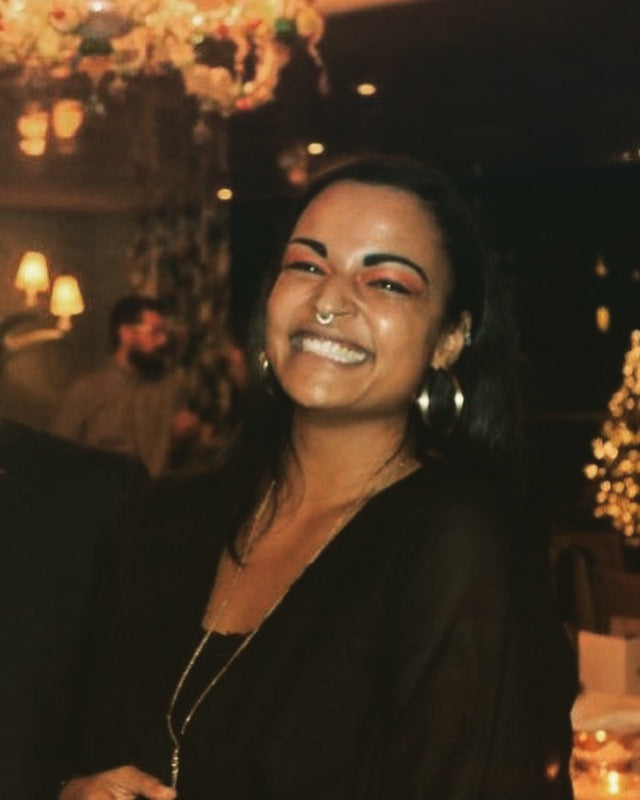 Christine, founder of Active Alcove, smiling in a warmly lit room